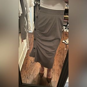 Houndstooth pencil skirt with side buttons and gather detail.